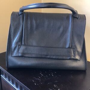 Made in Italy. Black leather bag.